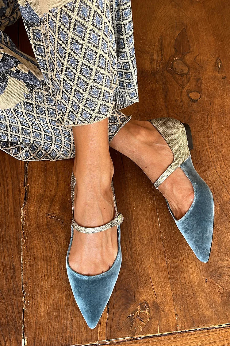 Blue patchwork ballerinas with pointed toes, strap, and buckle on the instep