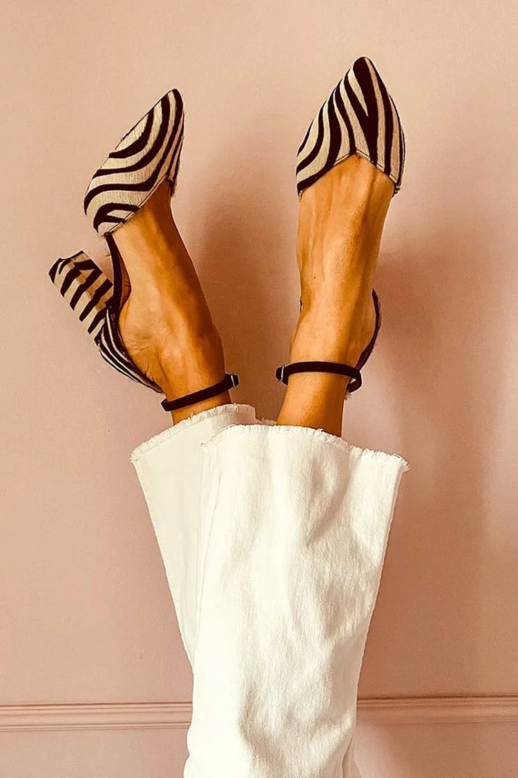 Pointed pumps with zebra print and ankle strap