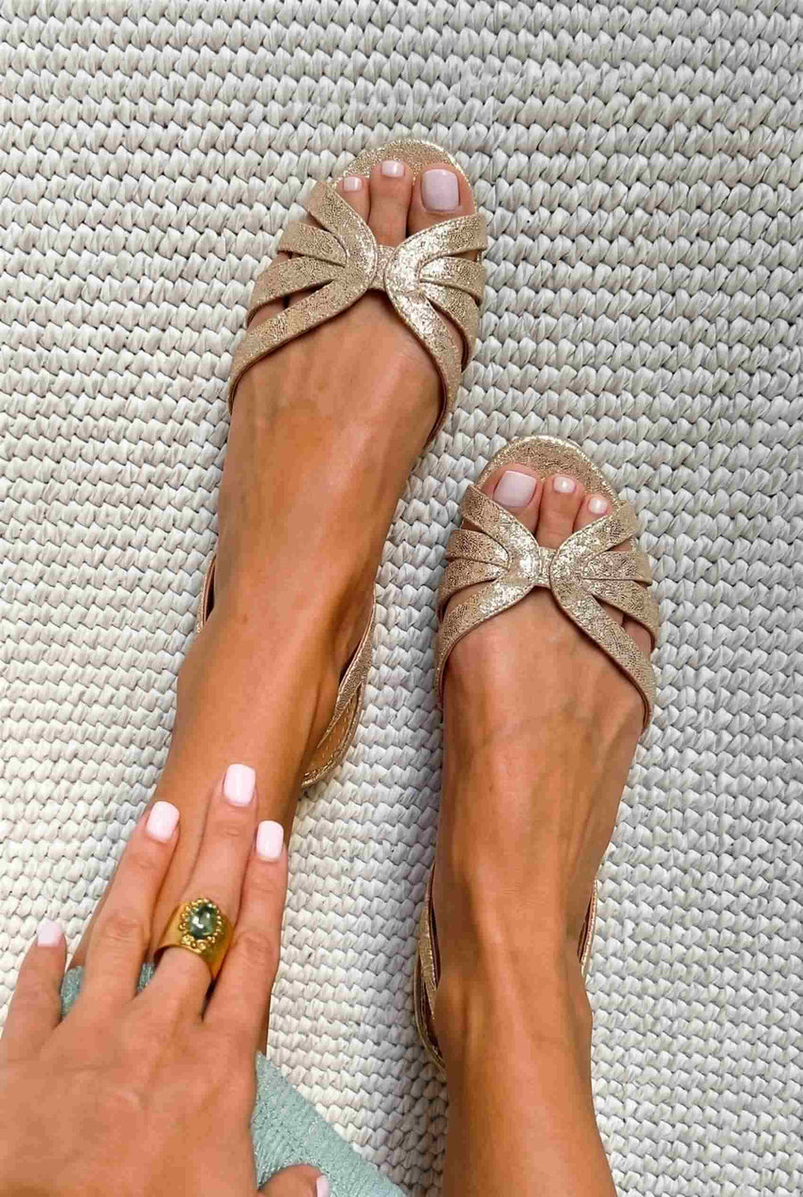Metallic gold low slingback sandals with open toe and straps
