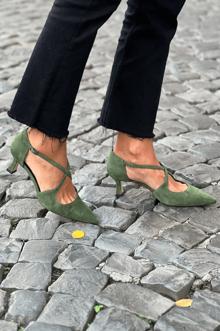 Green suede kitten heels with pointed toes and crossed straps