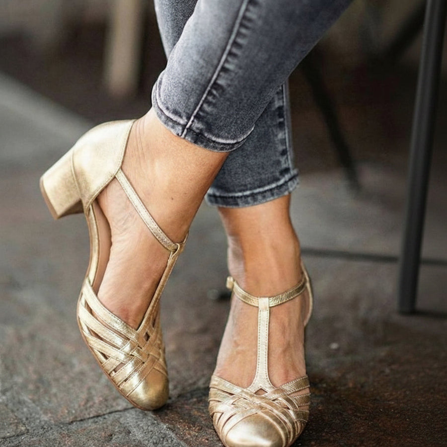 Elegant metallic Mary Jane court shoes with a T-strap and block heel