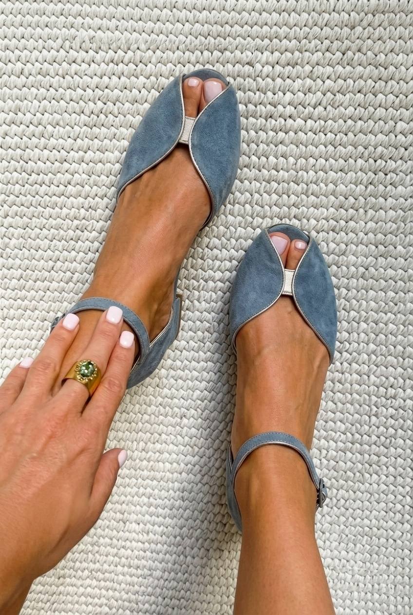 Chic blue suede flat sandals with metallic trim and open toe