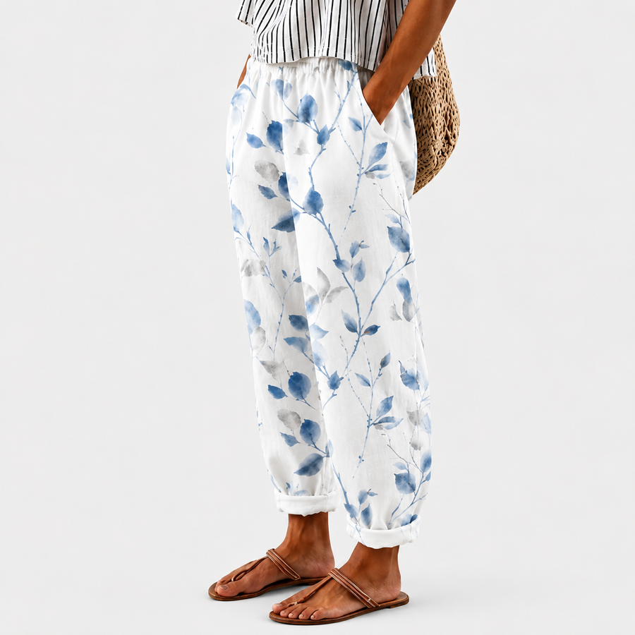 Comfort trousers with blue floral pattern on a light background
