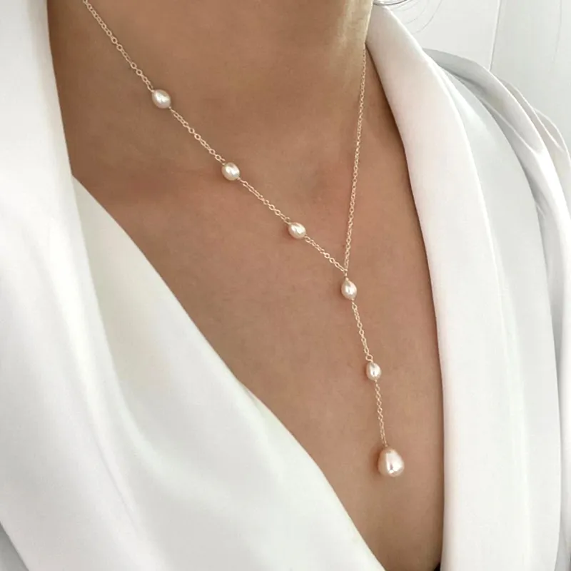 Lariat necklace with a cascade of pearls